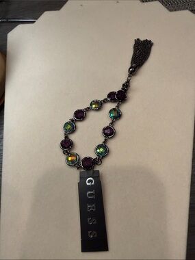 GUESS Purple and Iridescent Stone Bracelet with Gunmetal Tassel